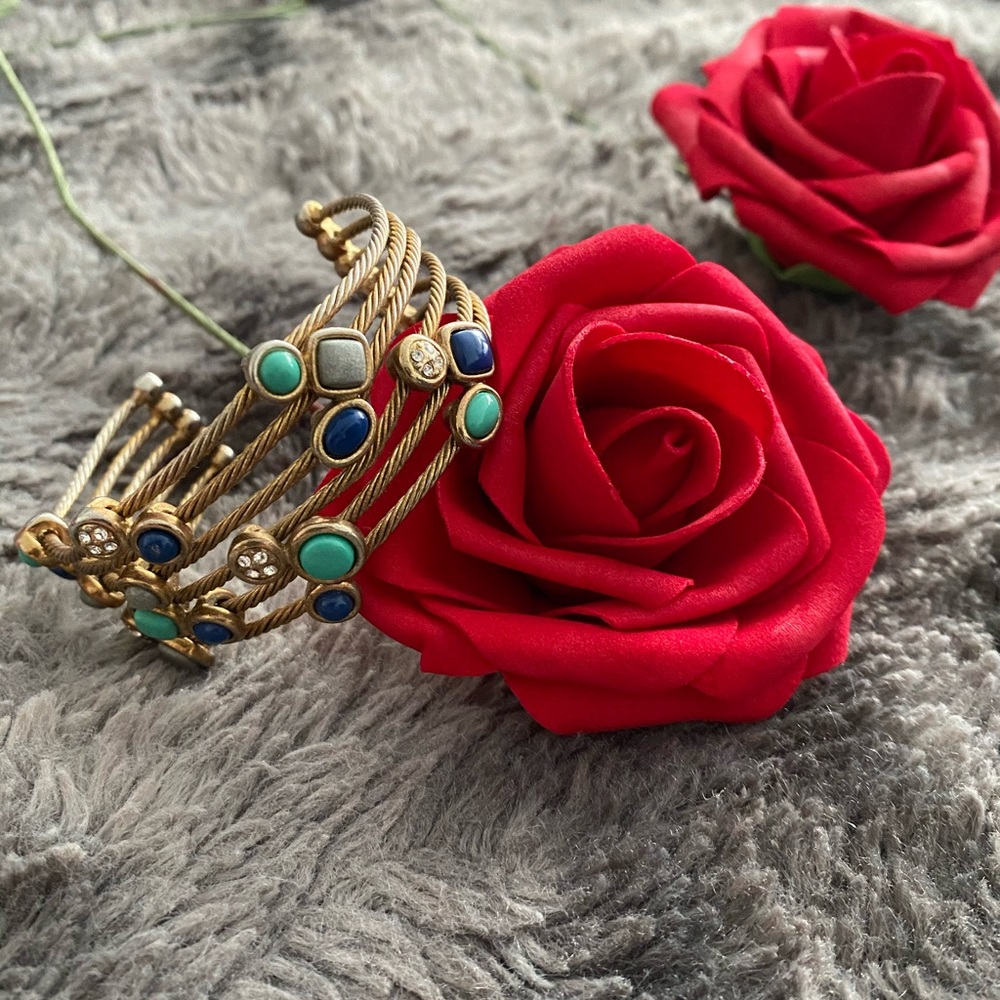 Gold wire bracelet with blue and grey stones